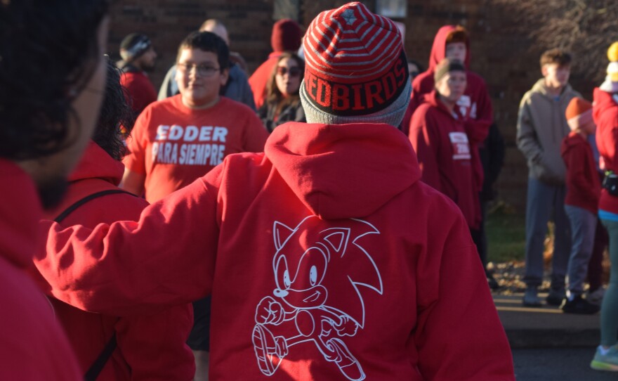 The Bloomington-Normal community showed up in red Saturday, Nov. 22, 2025, to honor Edder Diaz, a Parkside Junior High School seventh-grader who died Nov. 8, from injuries he'd suffered in a Nov. 2 home fire. The morning events included a Gift of Hope flag-raising ceremony, to recognize Edder as an organ donor, and the Redder for Edder Walk/Run, a fundraiser for the Diaz family. The race drew more than 800 registrations, organizers said. Edder's favorite color was red, and he was a fan of the cartoon character Sonic the Hedgehog, displayed on the back of many sweatshirts in the crowd.