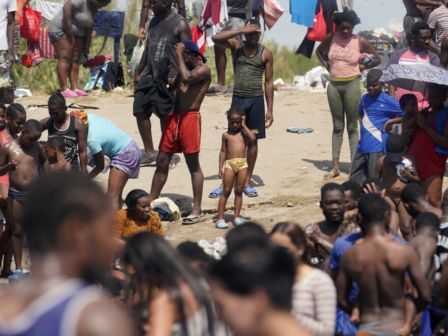 Haitian migrants gather on the banks of the Rio Grande on Saturday after they crossed into the United States from Mexico.