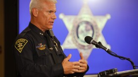 Monroe County Sheriff’s Office Chief Deputy Michael Fowler speaks during a news conference at the Monroe County Public Safety Building in Rochester on Thursday, Aug. 20, 2026, about the fatal shooting of Gregory Kase by sheriff’s deputies on Aug. 9. Kase was shot at a Super 8 motel in Henrietta after his wife called 911 to report that he was suicidal and in crisis. A notice of claim filed by Kase’s wife alleges responding deputies were not told that Kase was deaf