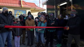 Diane Million cuts the ribbon for her new food truck business.