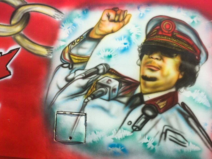 Yes, that is the late Libyan leader Moammar Ghadafi. On a bus. In Nairobi.