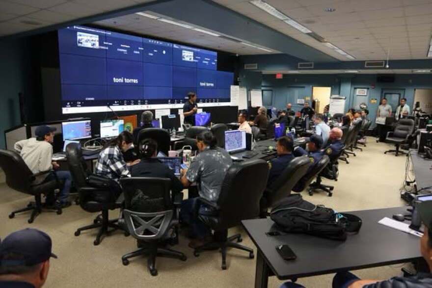 Officials with Kauaʻi Emergency Management Agency and various partners prepare at the Emergency Operations Center on Kauaʻi on Sunday morning preparing for potential impacts from Lowell.
