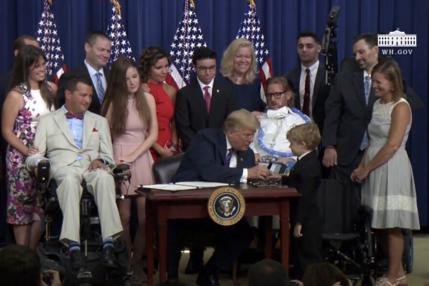 President Donald Trump with Jordan McLinn, 8, of Indianapolis.