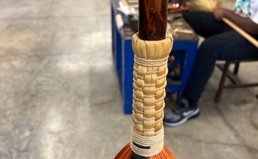 Students create different braids on the broom