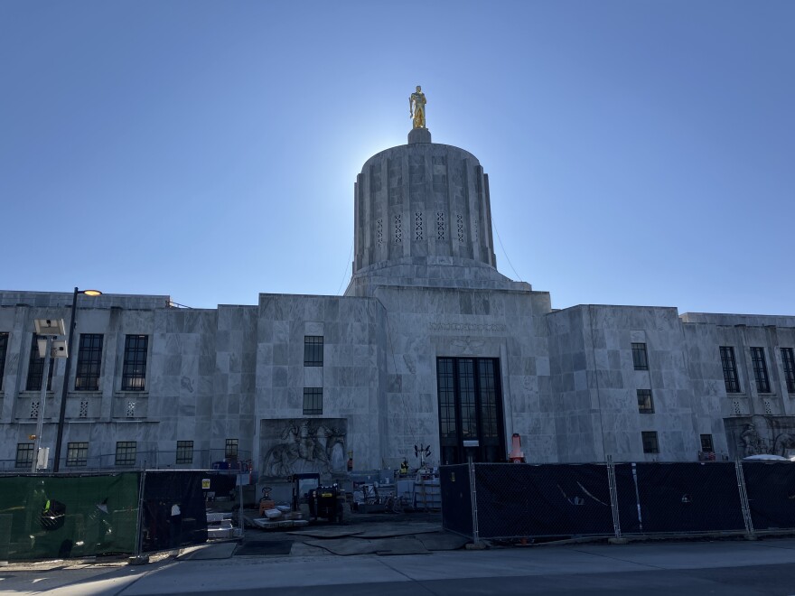 The Oregon Capitol. Construction equipment and fencing is seen in the foreground. 
