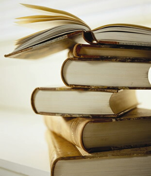 A stack of books from Ann Arbor District Library.