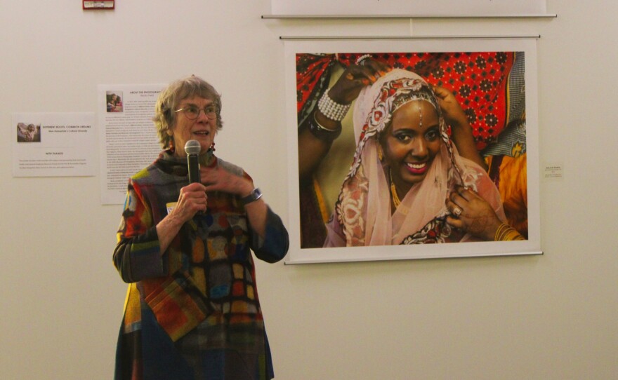 Becky Field speaks on Wednesday, Jan. 14, 2026, at a reception for her latest exhibit of "Different Roots, Common Dreams: New Hampshire's Cultural Diversity," a photo project on view at the Dartmouth-Hitchcock Medical center through March.