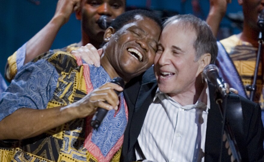 Paul Simon (center), Joseph Shabalala (left) and other members of Ladysmith Black Mambazo perform during the Library Of Congress Gershwin Prize For Popular Song Gala at the Warner Theater May 23, 2007 in Washington, DC.