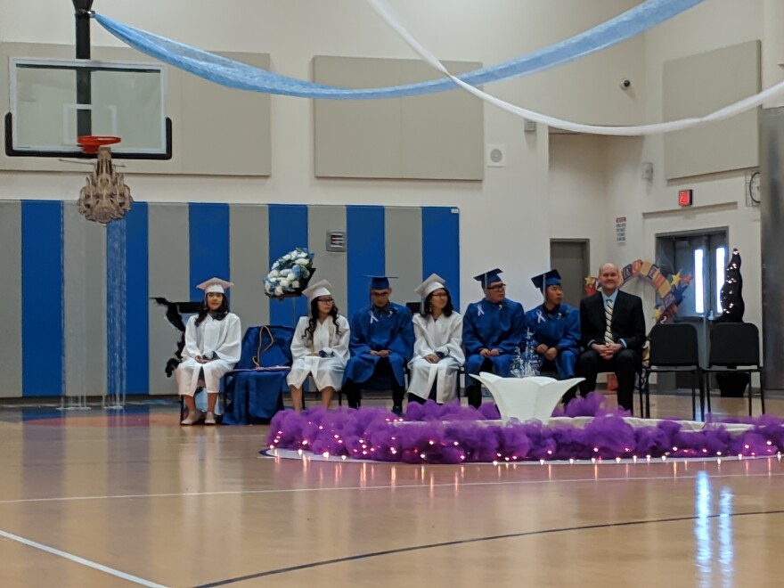 Keo's seat next to his classmates at graduation.