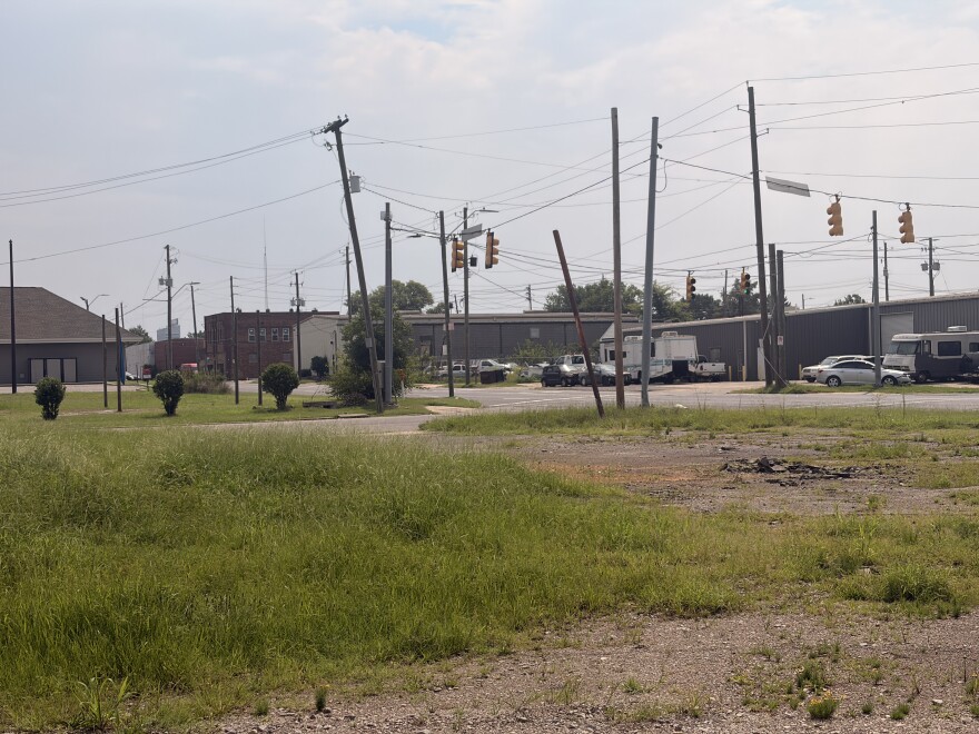 Along 3rd Avenue North, west of downtown Birmingham, sits a vacant lot with tall grass and signs of a burned-down structure.