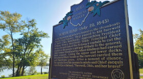a brown historical marker sign