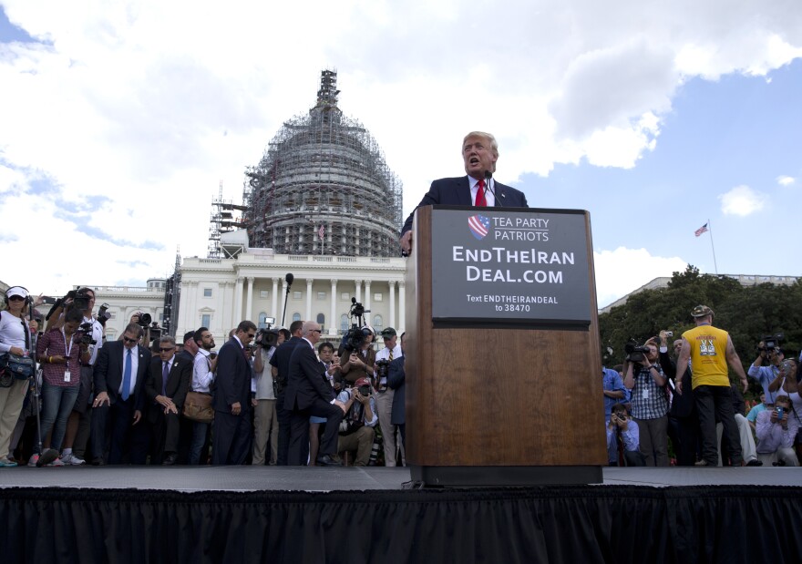 Then-Republican presidential candidate Donald Trump speaks at a rally organized by Tea Party Patriots on Capitol Hill, Sept. 9,2015, to oppose the Iran nuclear agreement.