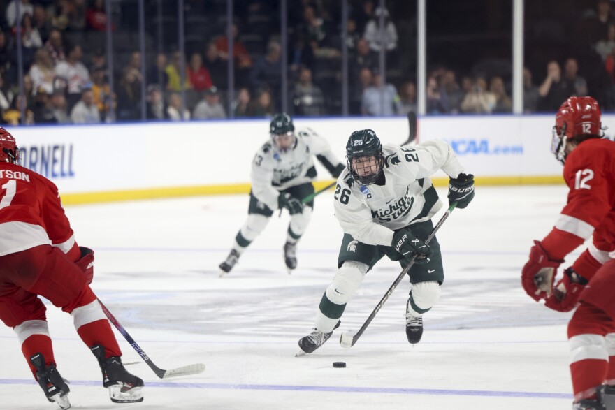 Michigan State's Tanner Kelly (26) advances the puck against Cornell during the first round of the NCAA college hockey tournament on Thursday, March 27, 2025, in Toledo, Ohio.