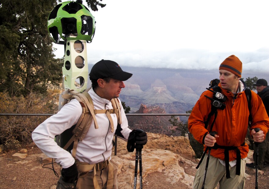 Google's Craig Robinson and James Hoffacker prepare to hike into the Grand Canyon. Robinson is wearing the new Google Trekker — a Street View camera mounted to a backpack. The Trekker's two lithium ion batteries can last eight hours and power 15 cameras. The pack — designed and built by Google — weighs 40 pounds.