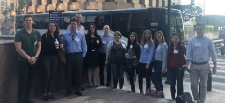 Nixon Peabody lawyers take a snap before the Justice Bus takes them to a legal clinic.