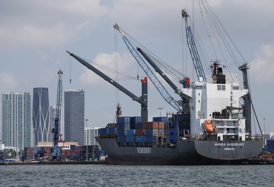 In this Wednesday, July 24, 2019 photo, the container ship Hansa Augsburg is shown docked at PortMiami in Miami. (AP Photo/Wilfredo Lee)