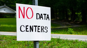 A sign protesting data center development