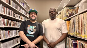 Cooley the Curator and T Hunt pose for a photo in the music library.