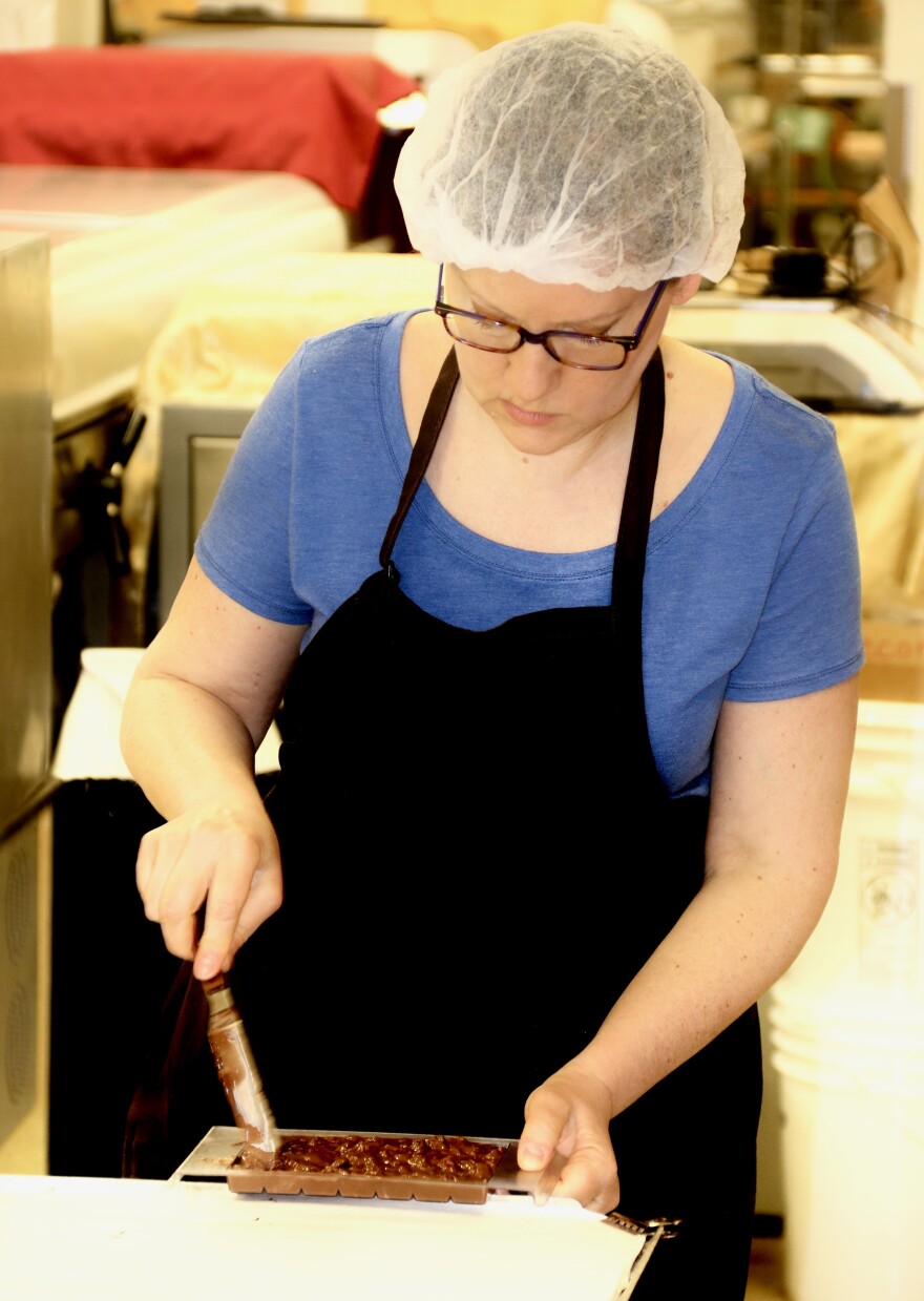 Another batch of custom-crafted-made-to-order chocolate bars go through the final stage of production at Wilmar Chocolates in downtown Appleton, Wisconsin