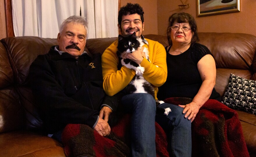 Juan Figueroa (center) and his parents, Juan Figueroa Sr. (left) and Angelina Figueroa (right), pose a photo for on New Year's Eve in 2018 in Dalhart, Texas. 