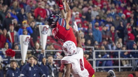 Liberty's CJ Daniels makes a reception over New Mexico State's Andre Seldon during the second half of the Conference USA championship NCAA college football game Friday, Dec. 1, 2023, in Lynchburg, Va. (AP Photo/Robert Simmons)
