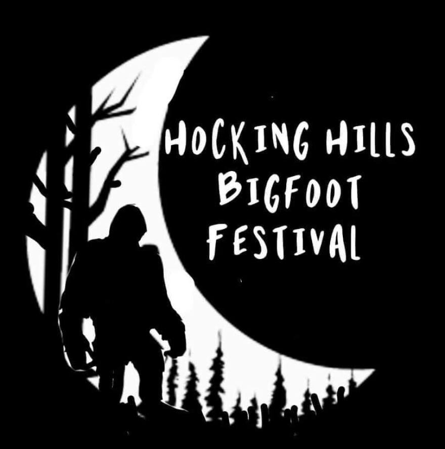 A white crescent moon against a black backdrop shows a glimpse of the silhouette of a Bigfoot-like creature standing in the woods. To the left of the graphic, it reads "Hocking Hills Bigfoot Festival".