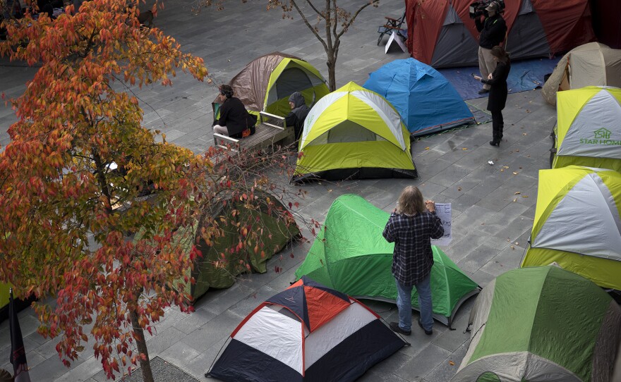 Tents are shown as people gathered to protest the sweeps of homeless camps in November, 2017, at City Hall in Seattle. 