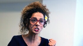 FILE: Iranian dissident Masih Alinejad answers questions during an interview with The Associated Press, Friday, Sept. 23, 2022, in New York.