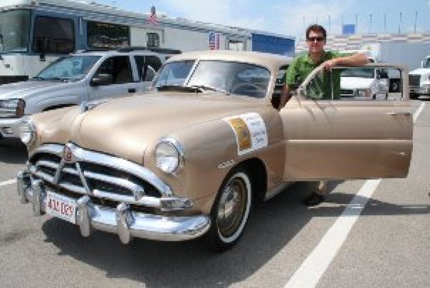 Author Dan McNichol takes a break from the cross country trip to commemorate the Interstate's 50th anniversary. He's driving his 51 Hudson Pacer in the convoy.