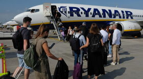 People board a Ryanair flight to Spain at Berlin Brandenburg Airport in Berlin, Germany.