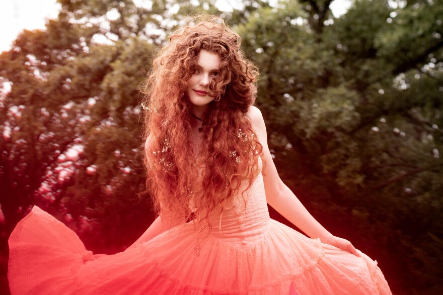 a woman in a dress posing for a photo