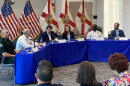 People sitting around a dais