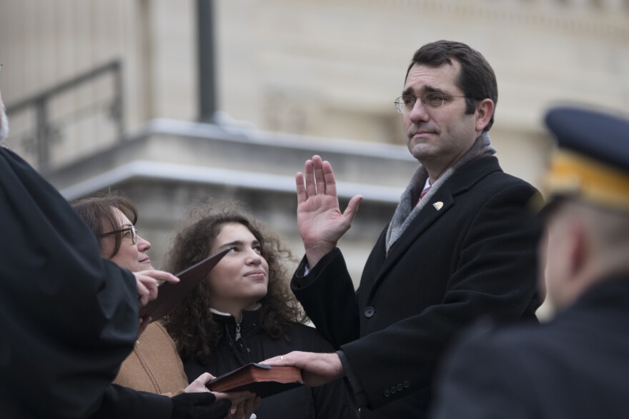  Kansas Attorney General Derek Schmidt takes the oath of office on the steps of the Kansas Capitol on Jan. 14, 2019. 