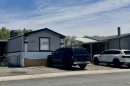 Multiple homes with cars parked outside
