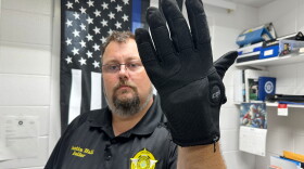 Nelson County, Ky., jailer Justin Hall shows an electric shock glove that is used at his facility, Thursday, Aug. 13, 2026, in Bardstown, Ky. (AP Photo/Dylan Lovan)