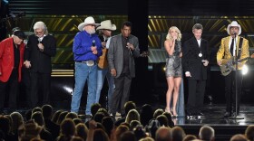 (Left to right) Roy Clark, Ricky Skaggs, Charlie Daniels, Dwight Yoakam, Charley Pride, Carrie Underwoiod, Randy Travis and Brad Paisley perform during the 50th annual CMA Awards at the Bridgestone Arena on Nov. 2, 2016 in Nashville, Tenn. (Rick Diamond/Getty Images)