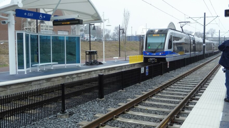 A Blue Line train approaches 9th Street Station uptown. 