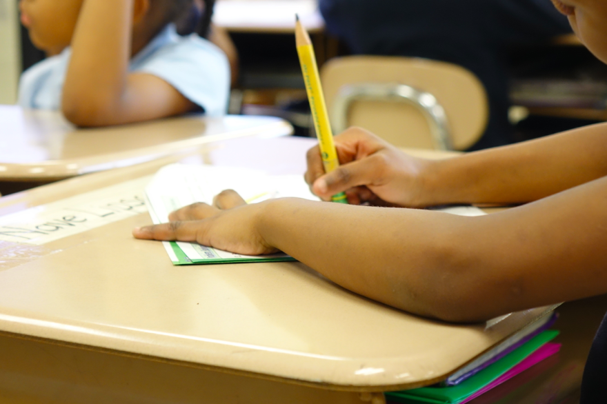 A student fills out a worksheet.