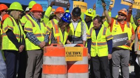 Gov. Gretchen Whitmer joins road workers in Clinton Township for the signing of a new road funding bill.