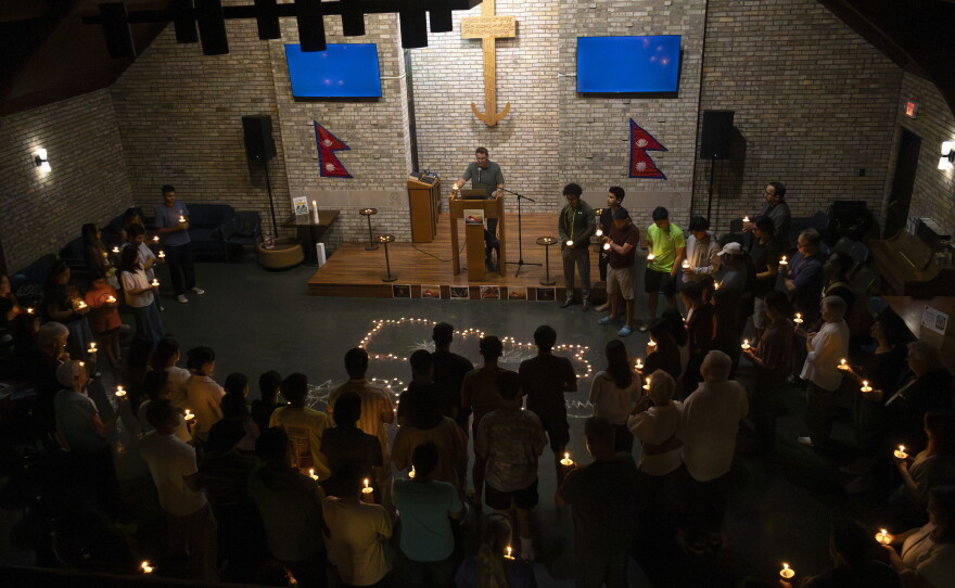 Doug Raddemann joins the attendees in remembrance for the lives lost in Nepal at the candlelight vigil at Hope Lutheran Ministries in Cape Girardeau, Mo, Wednesday, Sept. 9, 2026.