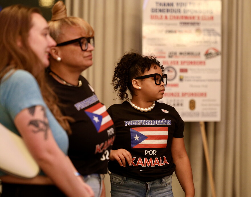 Cynthia Rochet and her 9-year-old granddaughter Cyn’laly Rochet attend the Monroe County Democrats' gathering at the Hyatt hotel in downtown Rochester on election night. Rochet also took Cyn'laly to vote with her earlier in the day.