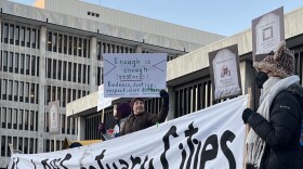 Dozens of demonstrators who rallied on Monday evening, March 2, 2026, outside the Kenneth B. Keating Federal Building and U.S. Courthouse on State Street in downtown Rochester.