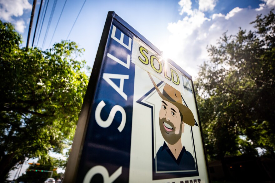 A "for sale" sign for a home in the Brentwood neighborhood of Austin.