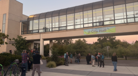 People gather outside Eugene City Hall on Monday, Sept. 14, after the council chambers reached capacity. The meeting included a 90-minute public comment section where speakers called for restrictions on data center development.