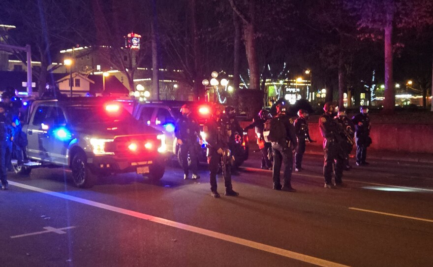 Police creating a barrier at an anti-ICE protest Friday, January 30 in Eugene.