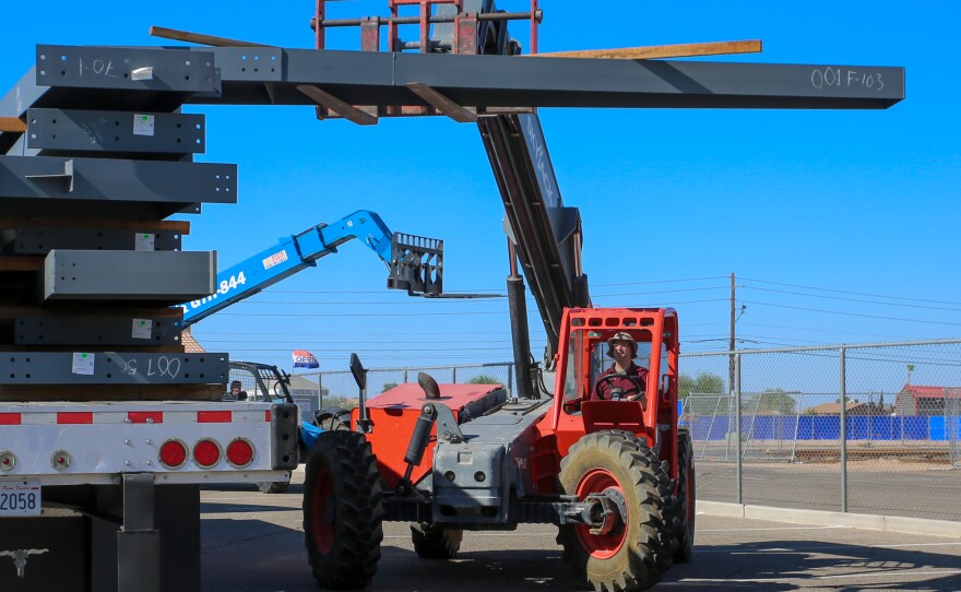 The structural steel beams had to be unloaded at the current San Luis campus because HPA lacked the necessary permit to do so at the actual lot.