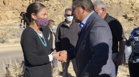 This Nov. 22, 2021 image shows former Hopi Vice Chairman Clark Tenakhongva, right, talking with U.S. Interior Secretary Deb Haaland after a celebration at Chaco Culture National Historical Park in northwestern New Mexico. Some tribes in the Southwest applauded Haaland's announcement that her agency was beginning the process to withdrawal federal land holdings near the park from oil and gas development for 20 years. (AP Photo/Susan Montoya Bryan)