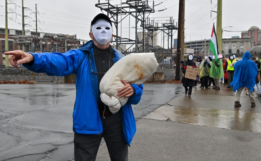 Veteran and Carbondale native, Jack Gilroy, wears a mask and prop during the Rally for Palestine in Scranton.