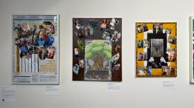 The photo depicts three collages side-by-side on display at the exhibition titled "Living and Loving Under the Carceral State" at King Street Station. The artist used photos of her brother and his children for the pieces. One includes a drawing of a tree with its roots growing in a concrete-like structure. 