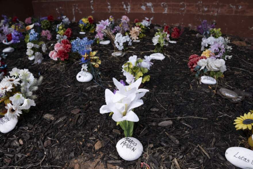 Rocks and artificial flowers fill a memorial garden in front of the Oklahoma County Jail in Oklahoma City, Oklahoma on Thursday August 21, 2025. (Nick Oxford for Here & Now)